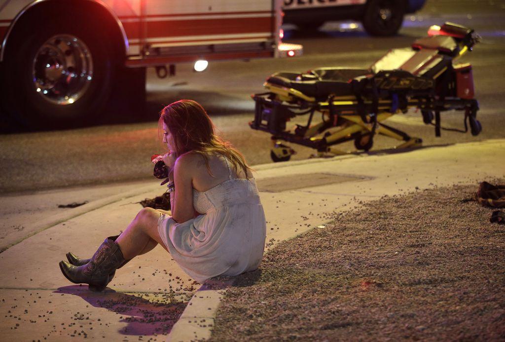 Girl in cowboy boots near ambulance